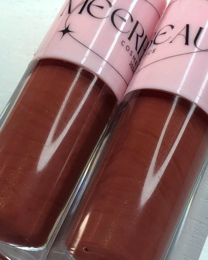 Close up of two warm brown glosses with a fine gold shimmer