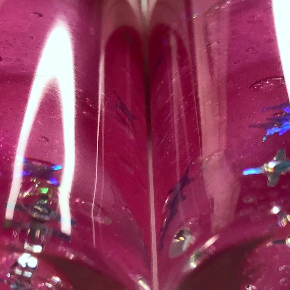 Pixie Dust shimmer gloss close up in two pink-capped tubes