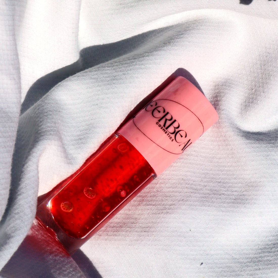 Orange Peach, high shine tinting jelly gloss, in a pink-capped MEERBEAUT wand tube